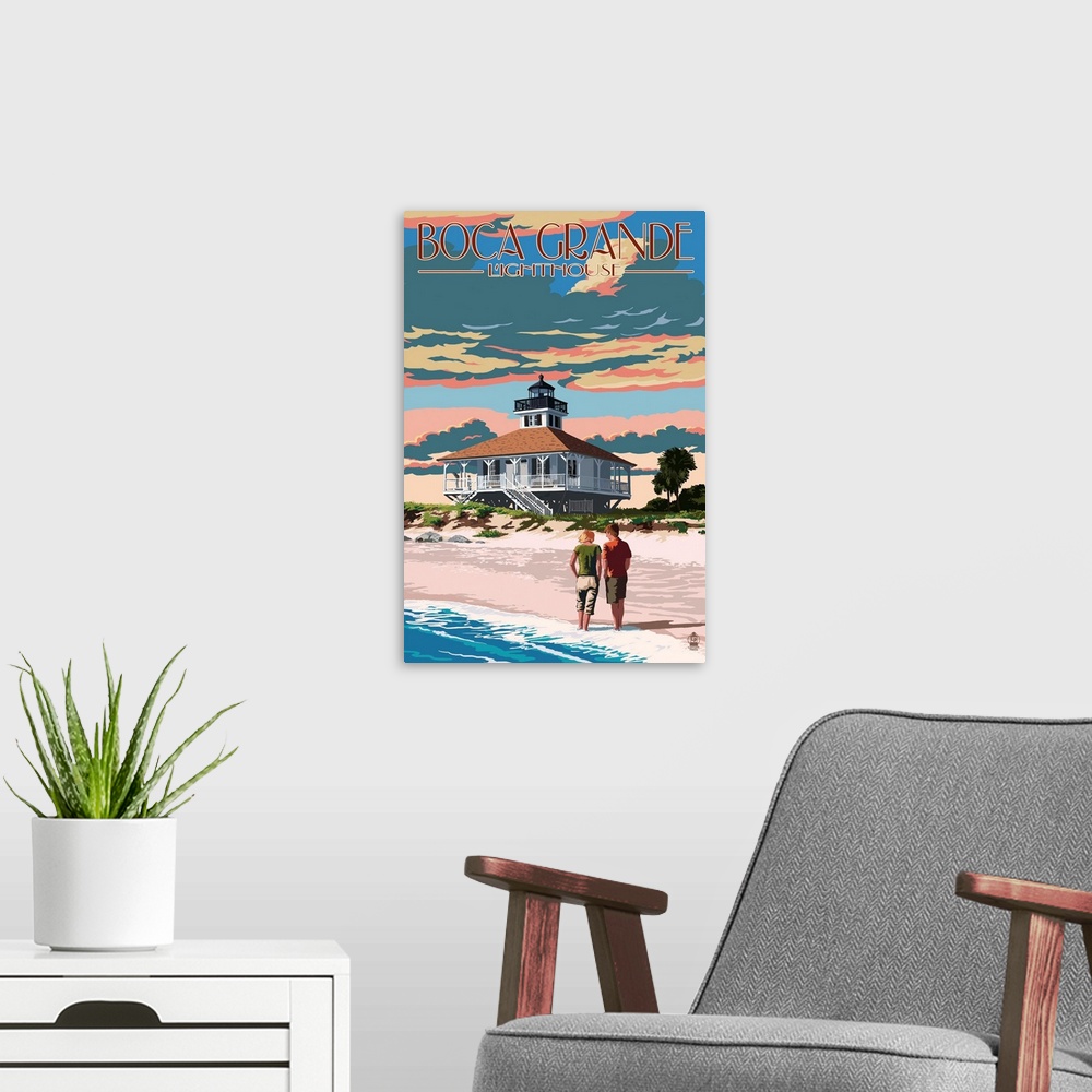 A modern room featuring Stylized art poster of a couple walking up the shore of a sandy beach towards a lighthouse.