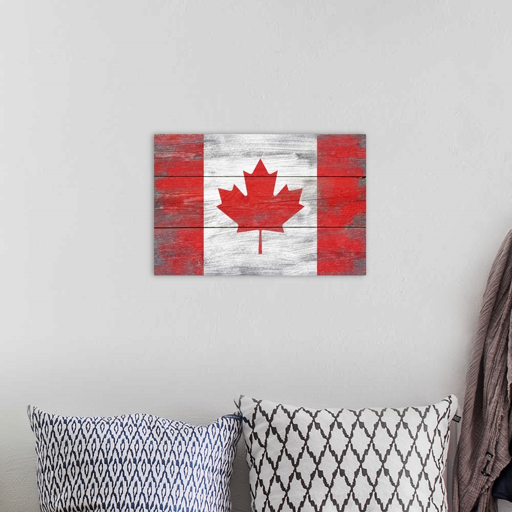 A bohemian room featuring The flag of Canada with a weathered wooden board effect.