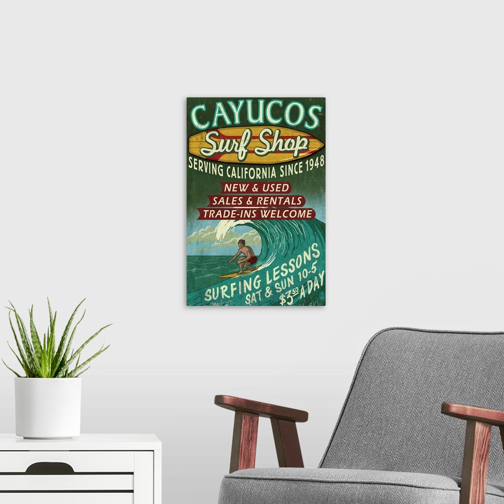 A modern room featuring Retro stylized art poster of vintage sign with a surfer in a curled wave on the ocean.