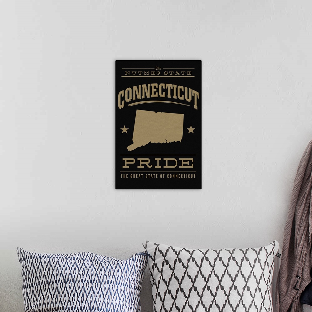 A bohemian room featuring The Connecticut state outline on black with gold text.