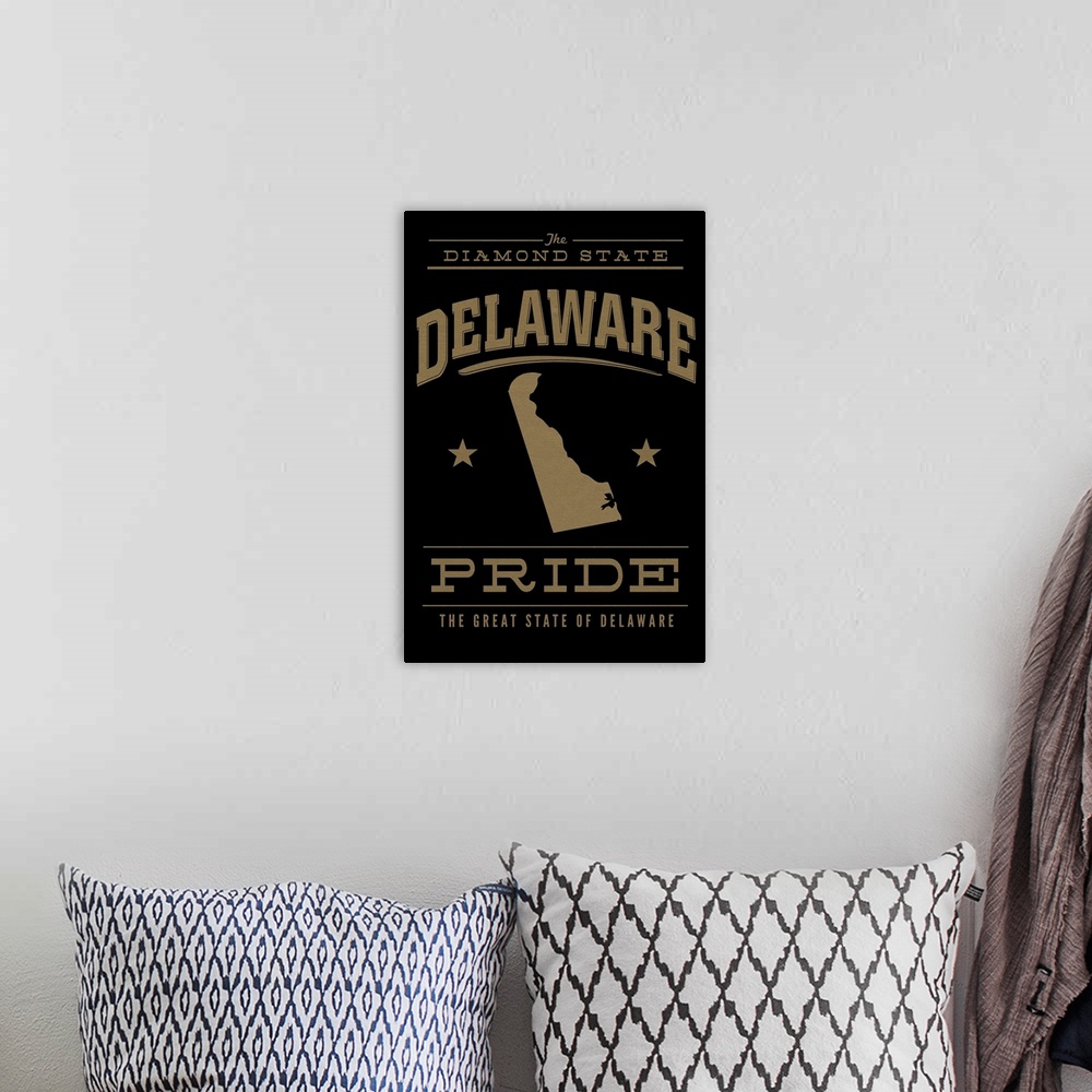 A bohemian room featuring The Delaware state outline on black with gold text.