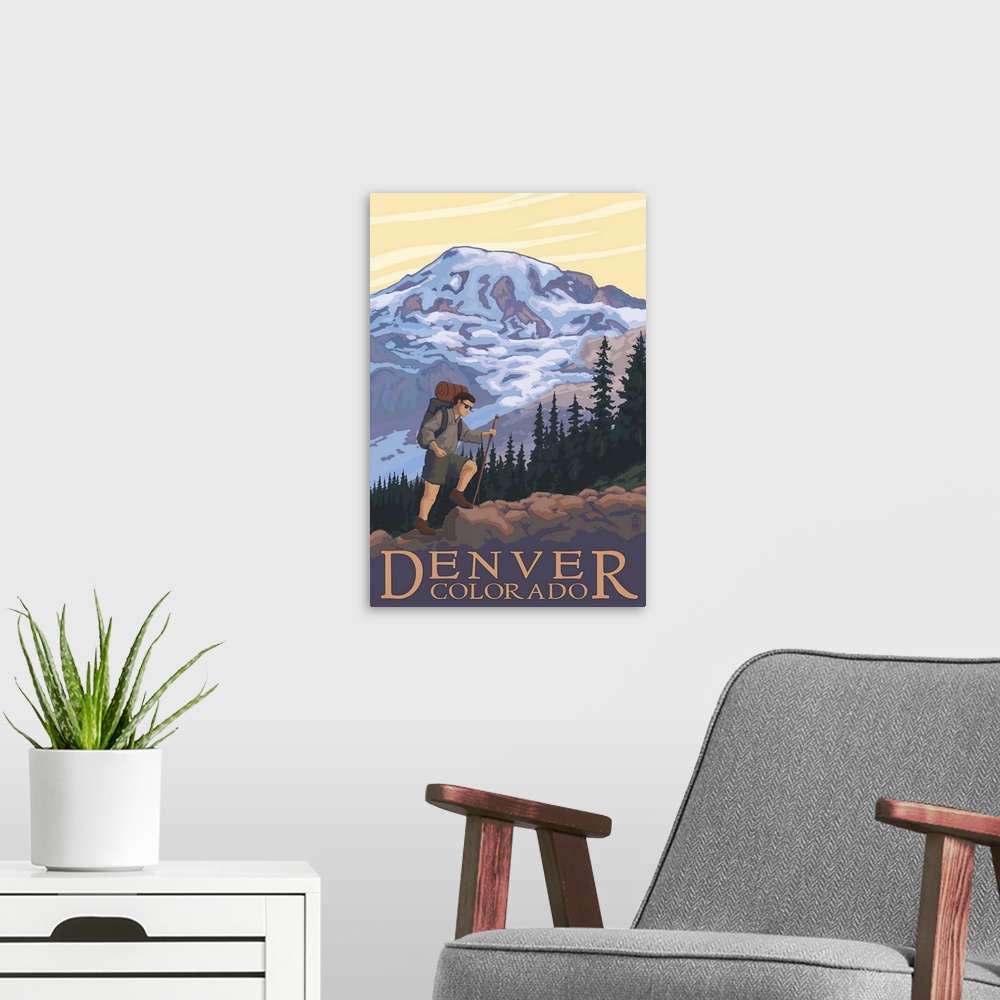 A modern room featuring Retro stylized art poster of a hiker walking a trail, with a mountain in the background.