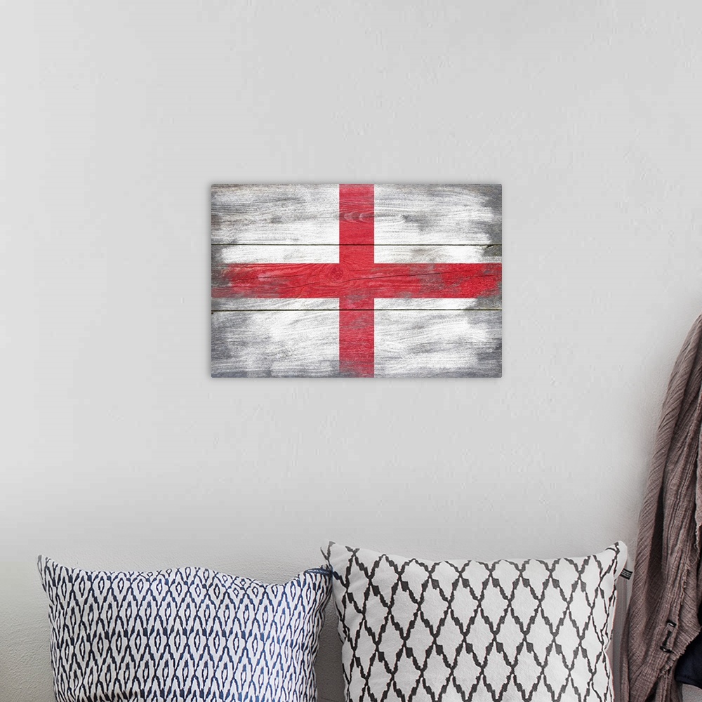 A bohemian room featuring The flag of England with a weathered wooden board effect.