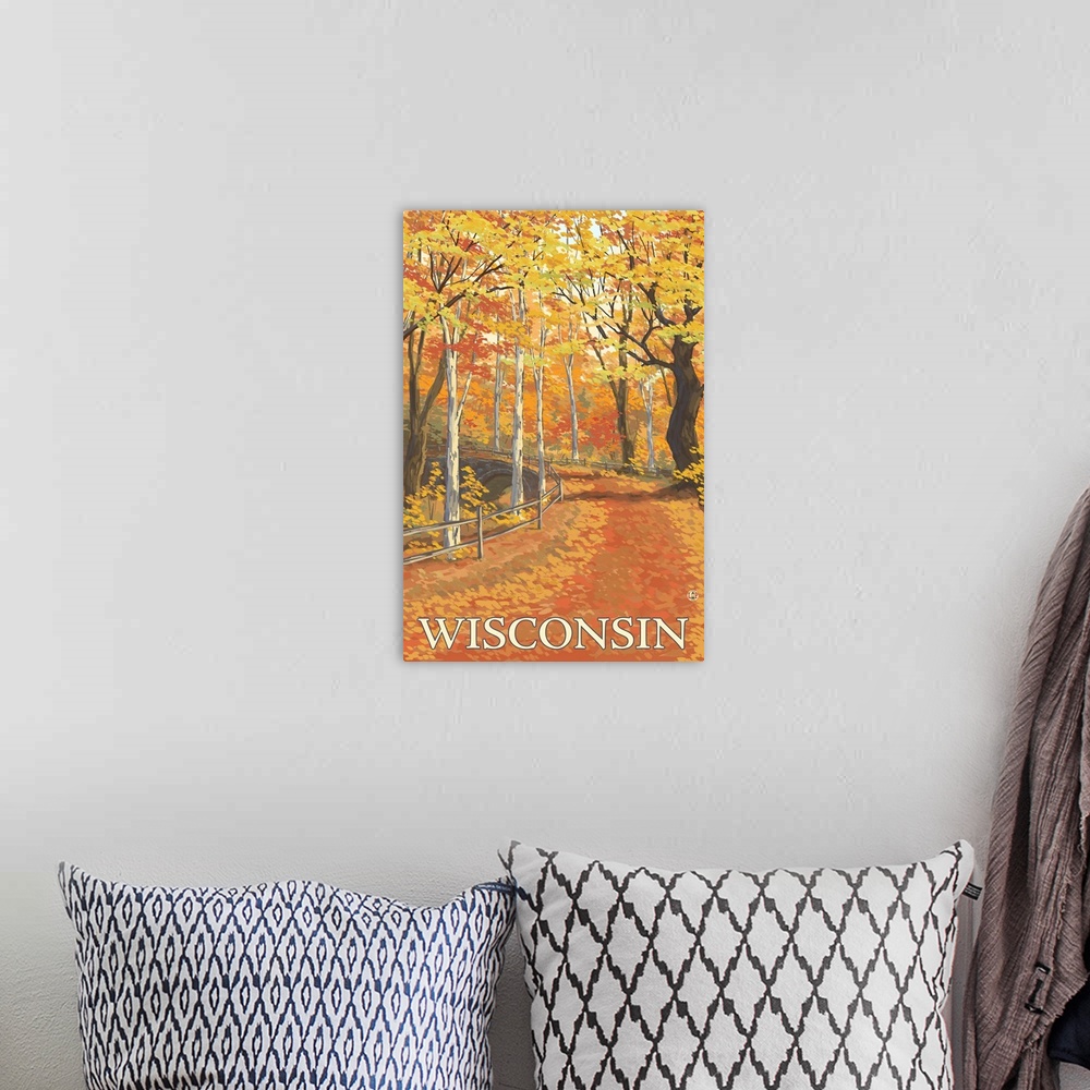 A bohemian room featuring A stylized art poster of a road through an autumn forest that passes over a stone arch bridge.