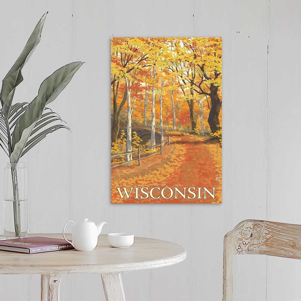 A farmhouse room featuring A stylized art poster of a road through an autumn forest that passes over a stone arch bridge.