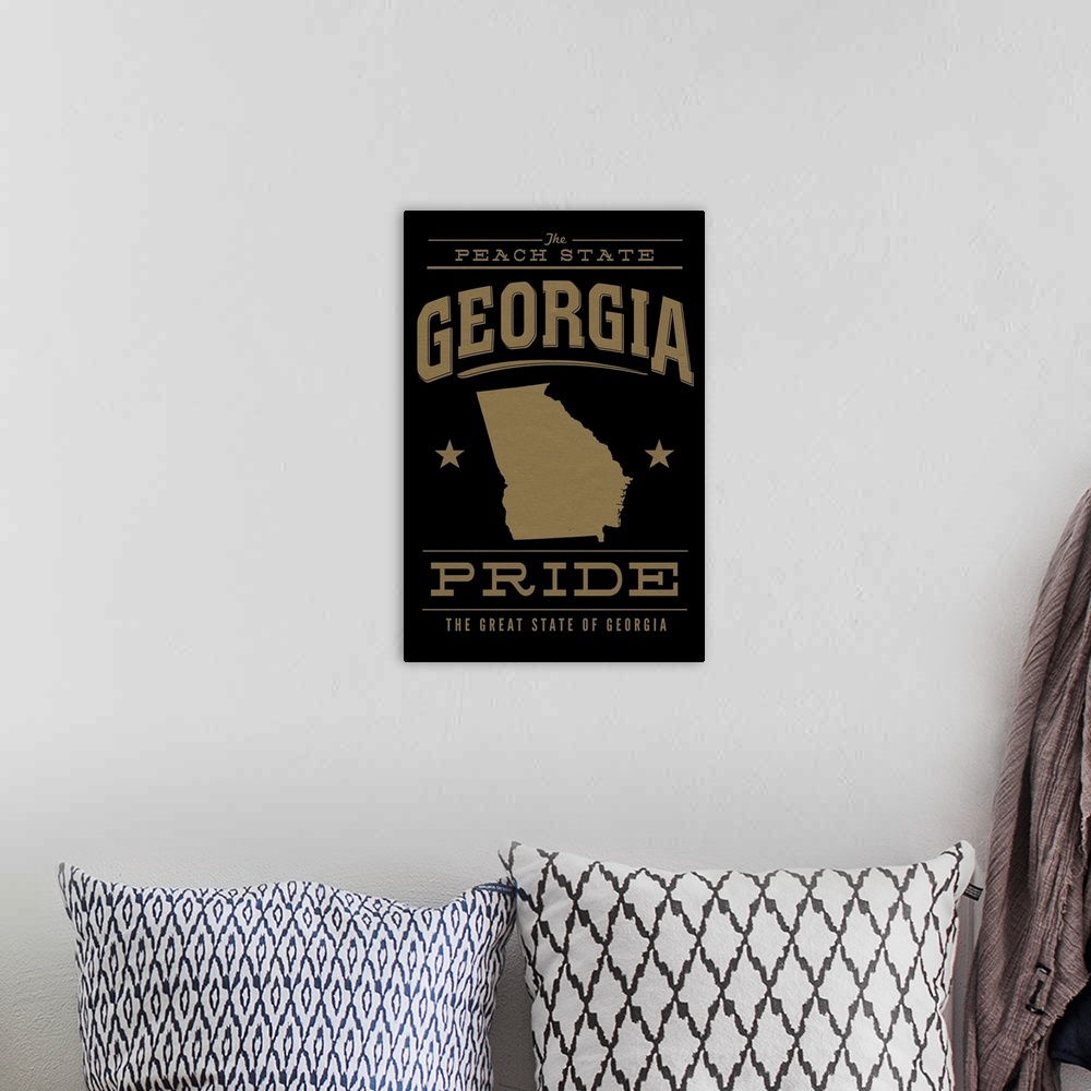 A bohemian room featuring The Georgia state outline on black with gold text.