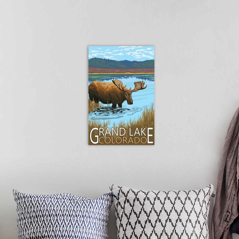 A bohemian room featuring Retro stylized art poster of a moose standing in a stream drinking, with mountains in the backgro...