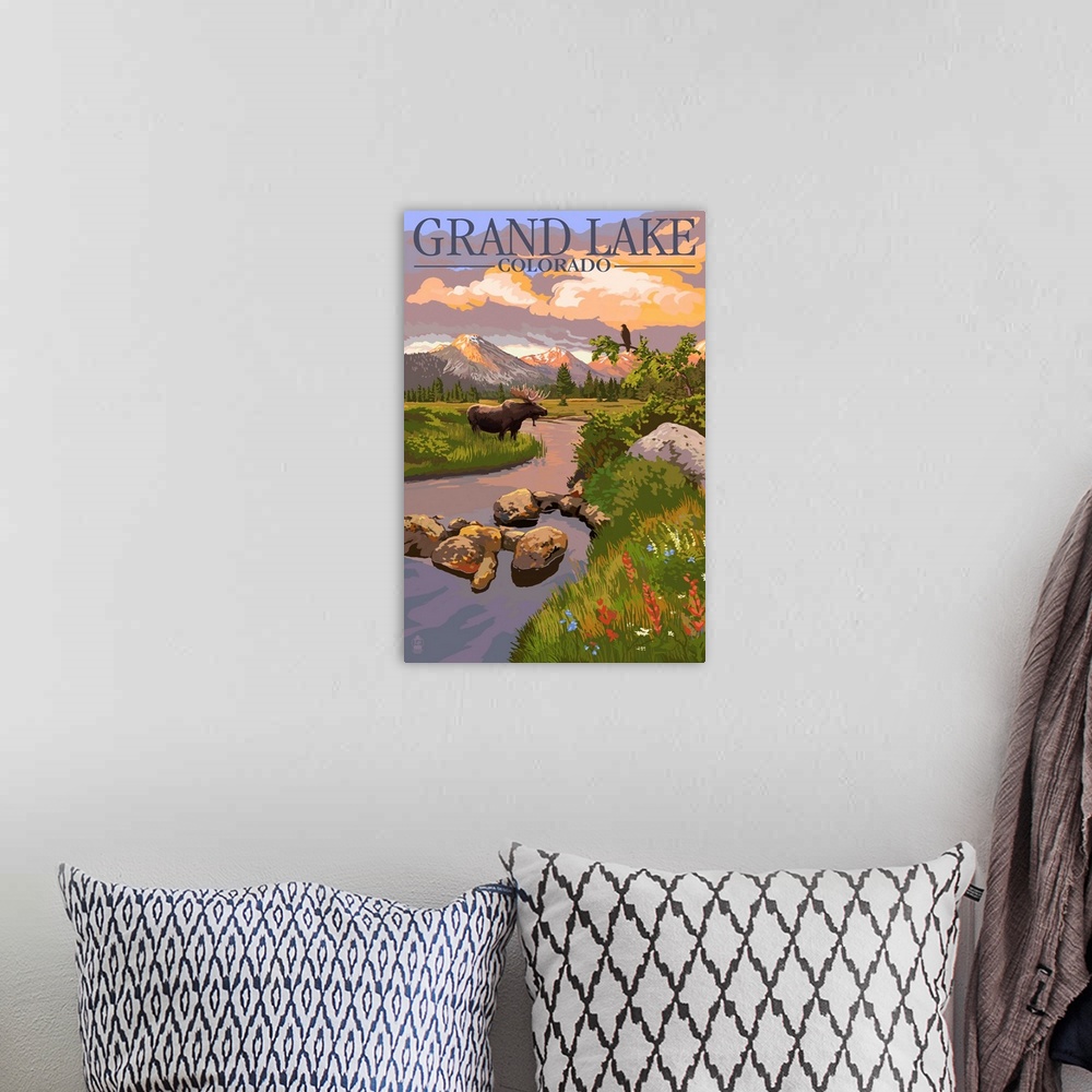 A bohemian room featuring Retro stylized art poster of a moose standing beside a stream, with mountains in the background.