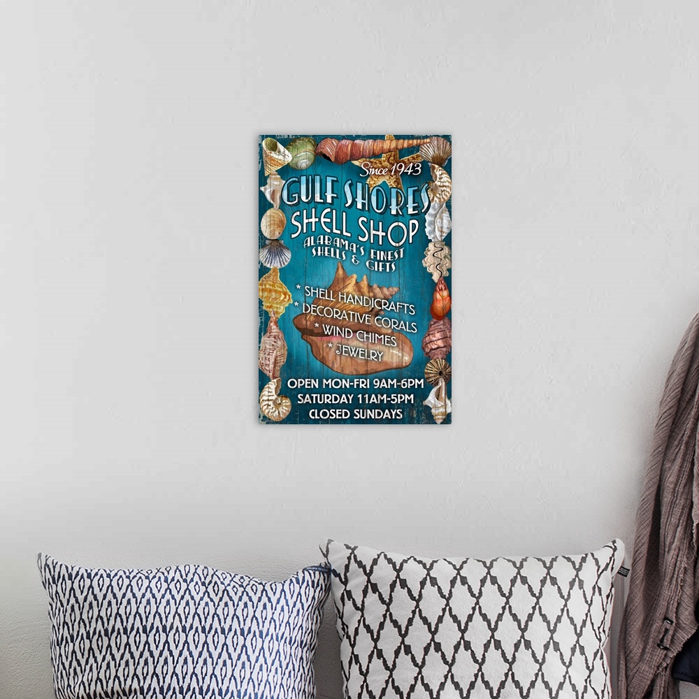 A bohemian room featuring Retro stylized art poster advertising a local gift shop specializing in sea shells.