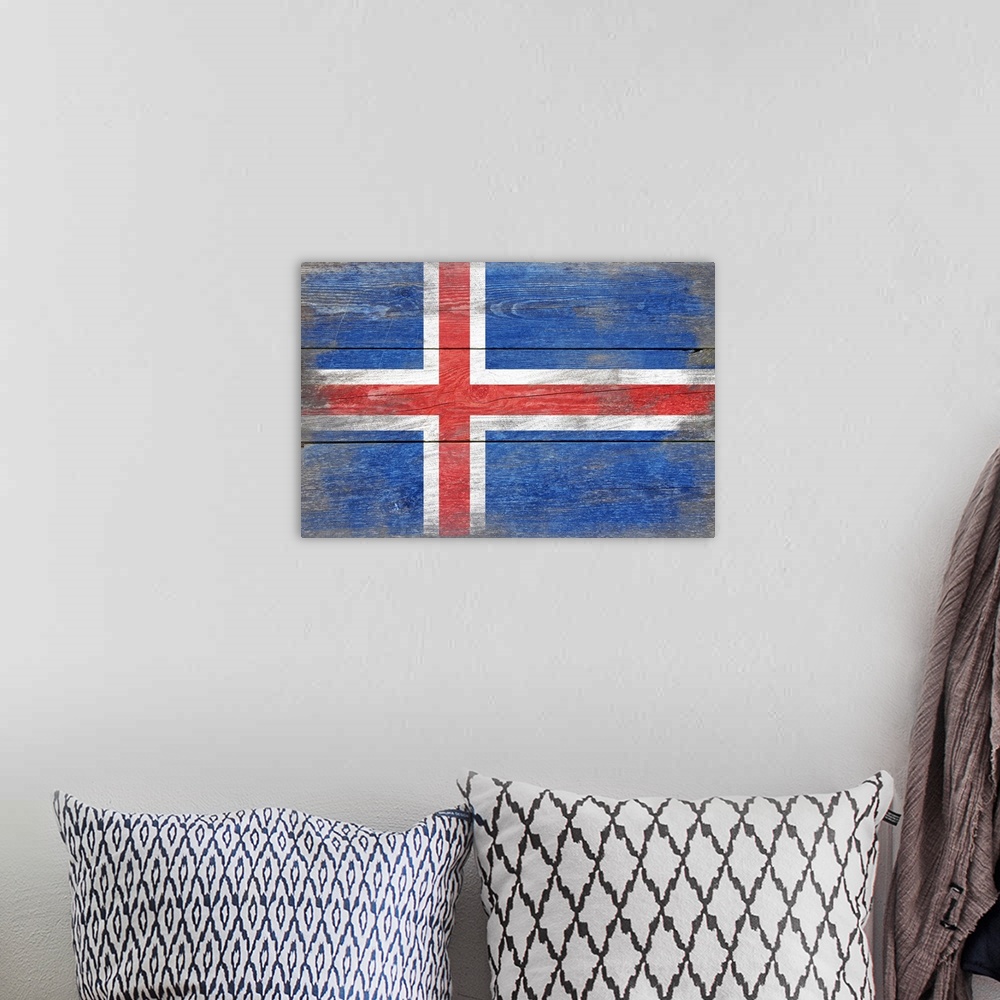 A bohemian room featuring The flag of Iceland with a weathered wooden board effect.