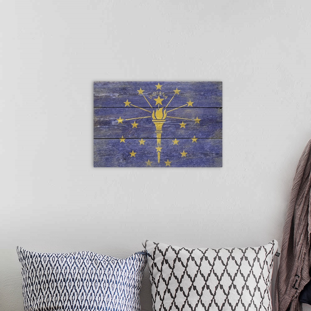A bohemian room featuring The flag of Indiana with a weathered wooden board effect.