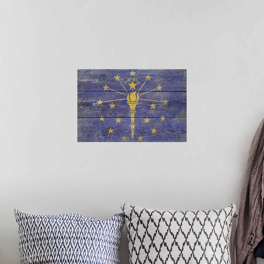 A bohemian room featuring The flag of Indiana with a weathered wooden board effect.