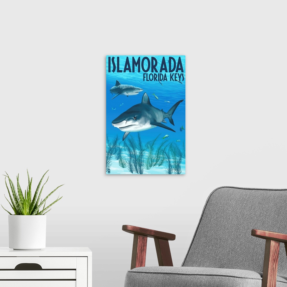 A modern room featuring A stylized art poster of sharks swimming near the shallow ocean floor off the coast.