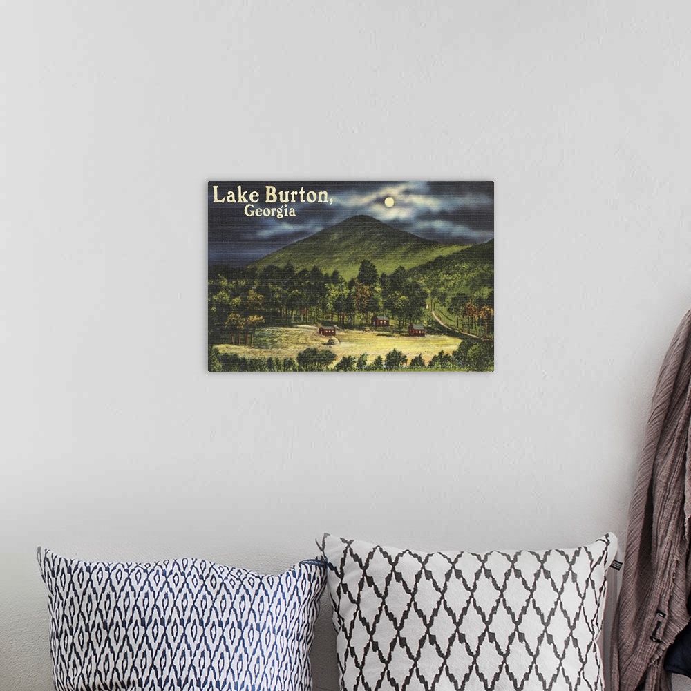 A bohemian room featuring Retro stylized art poster of a valley at night moon lightly shrouded by a cloudy sky.