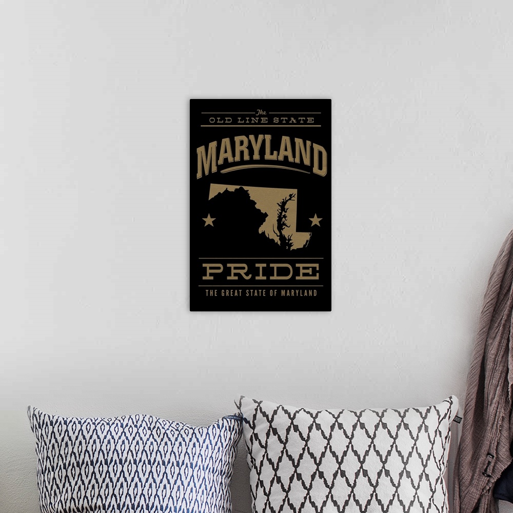 A bohemian room featuring The Maryland state outline on black with gold text.
