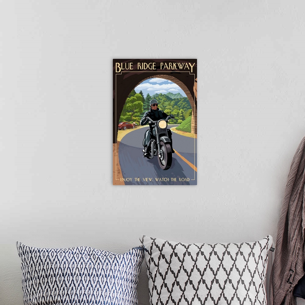 A bohemian room featuring Retro stylized art poster of motorcycle rider just crossing into a tunnel.