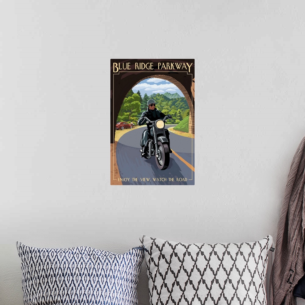 A bohemian room featuring Retro stylized art poster of motorcycle rider just crossing into a tunnel.