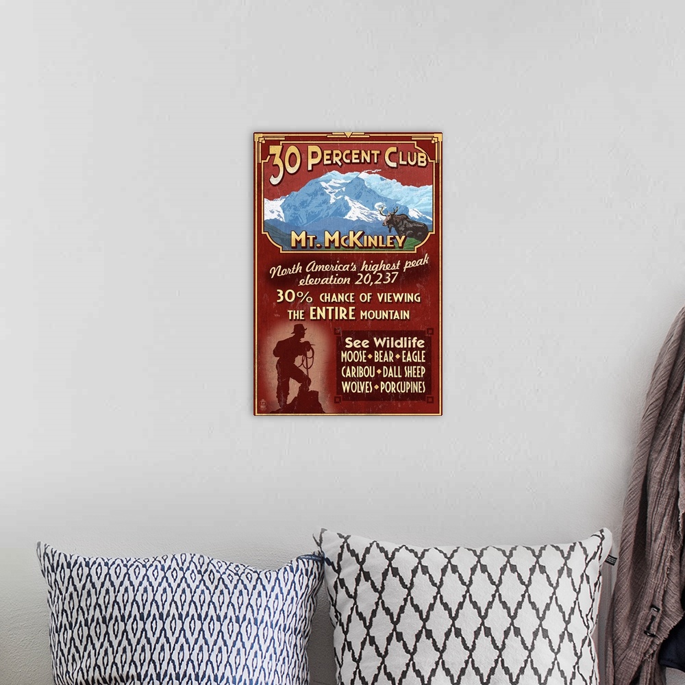 A bohemian room featuring Retro stylized art poster of a moose in the wild and the silhouette of a hiker at the bottom of t...