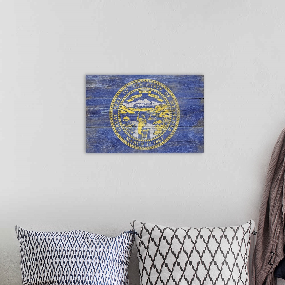 A bohemian room featuring The flag of Nebraska with a weathered wooden board effect.