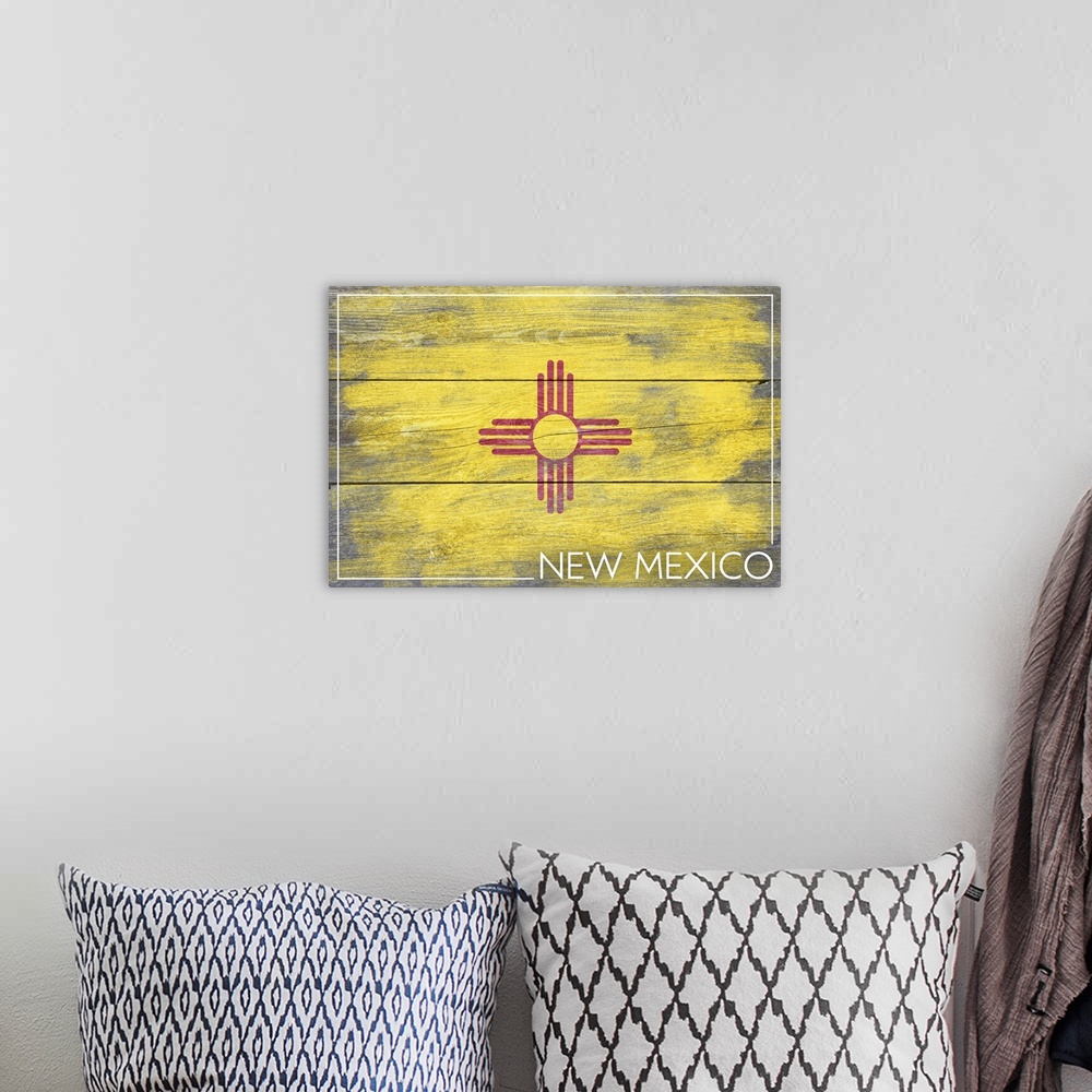 A bohemian room featuring The flag of New Mexico with a weathered wooden board effect.