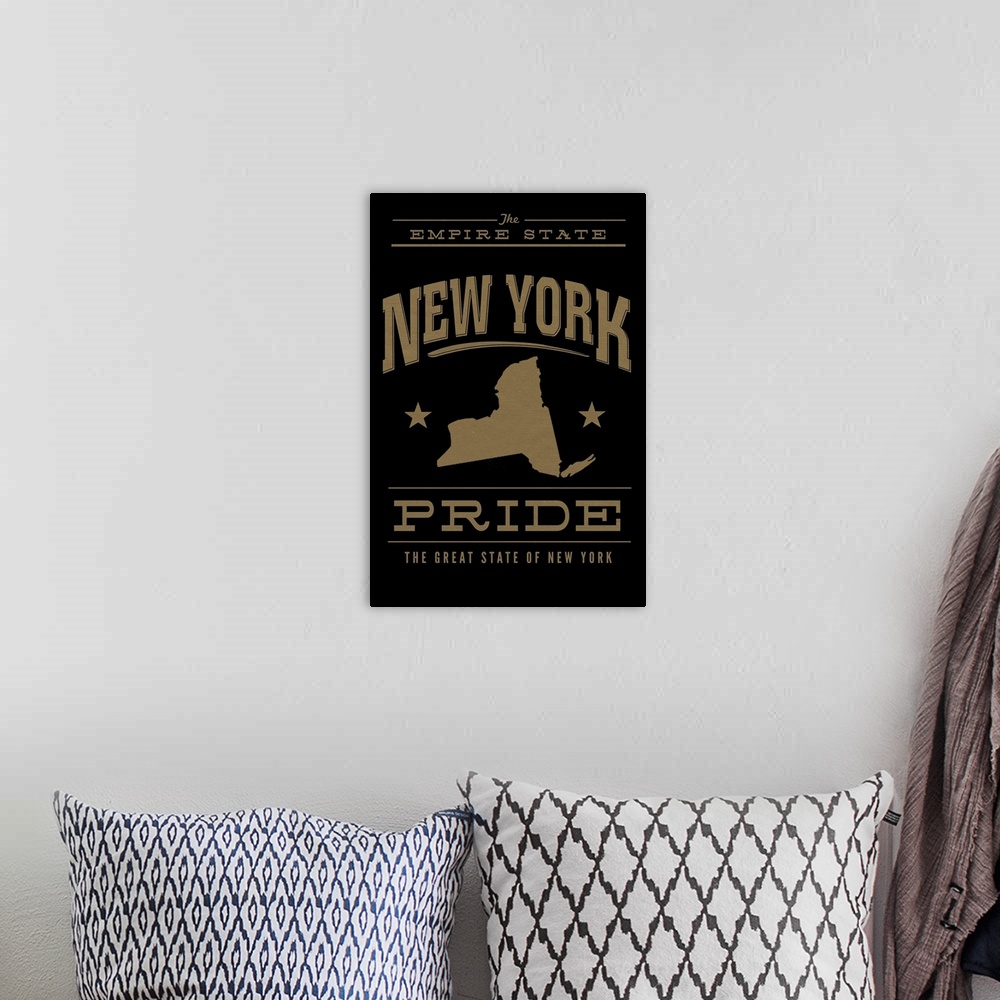 A bohemian room featuring The New York state outline on black with gold text.