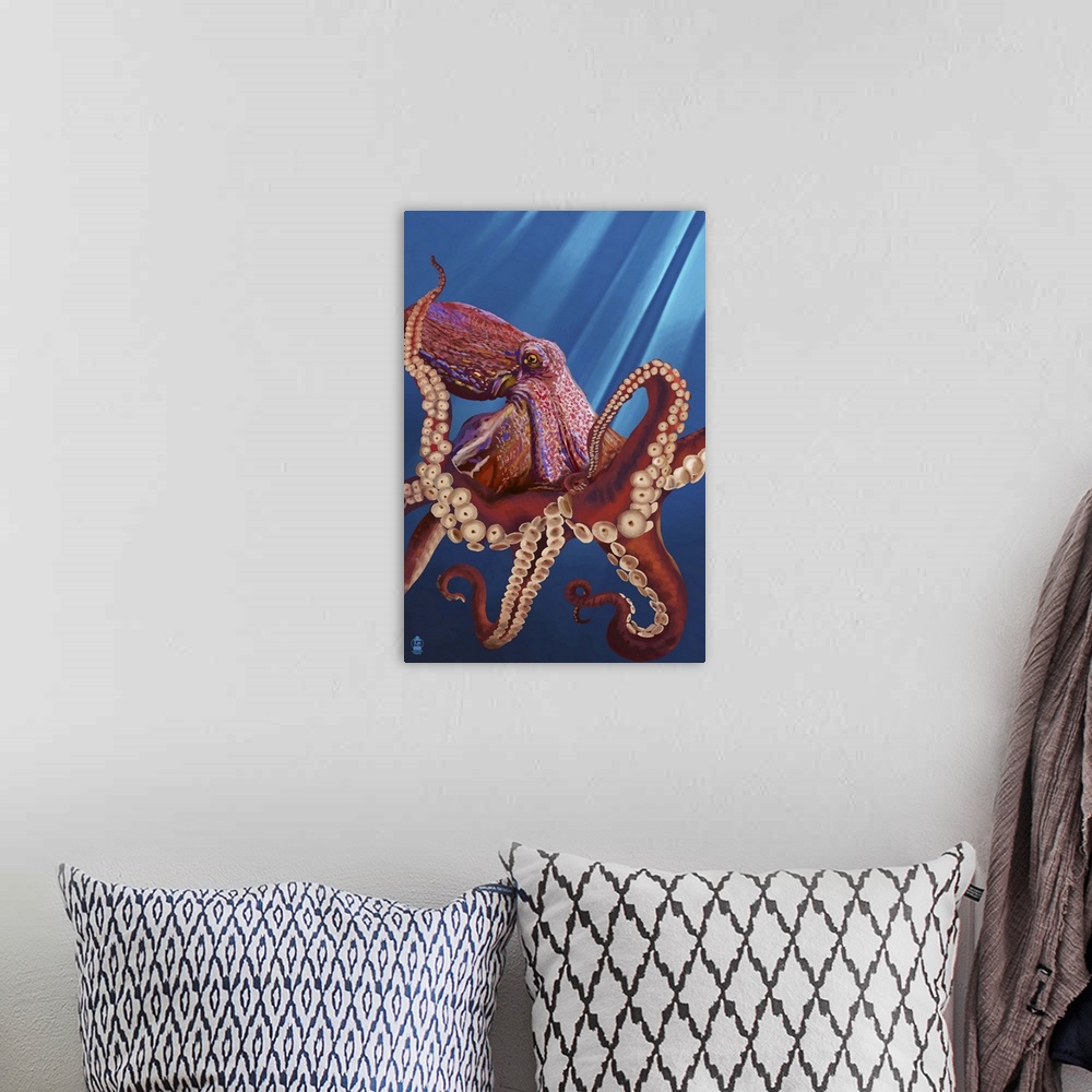 A bohemian room featuring Retro stylized art poster of an octopus hovering in the ocean, with sun rays piercing the water.