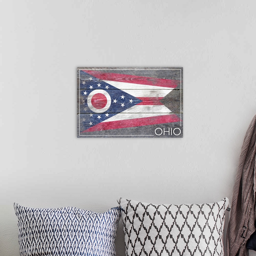 A bohemian room featuring The flag of Ohio with a weathered wooden board effect.