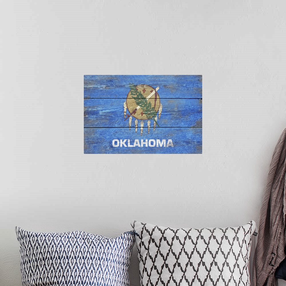 A bohemian room featuring The flag of Oklahoma with a weathered wooden board effect.