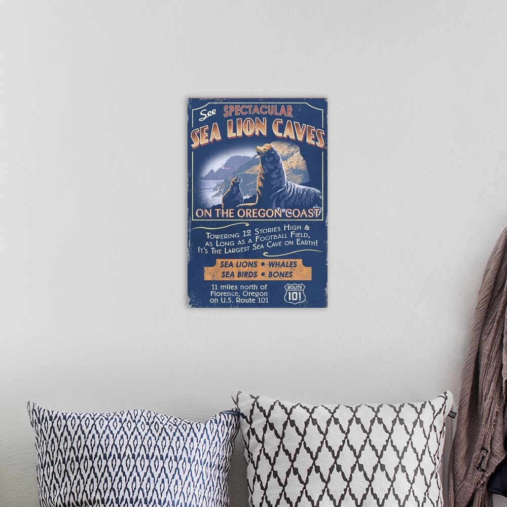 A bohemian room featuring Retro stylized art poster of a vintage sign of sea lions in a coastal scene.