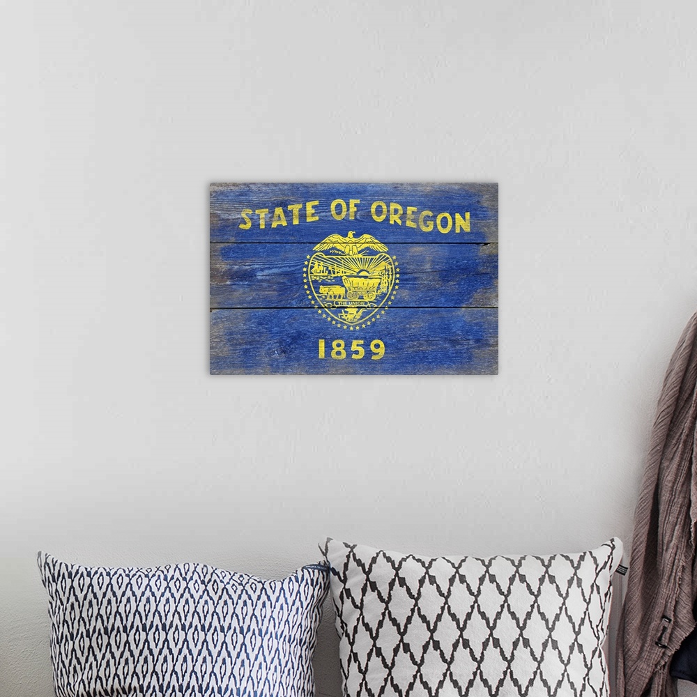 A bohemian room featuring The flag of Oregon with a weathered wooden board effect.