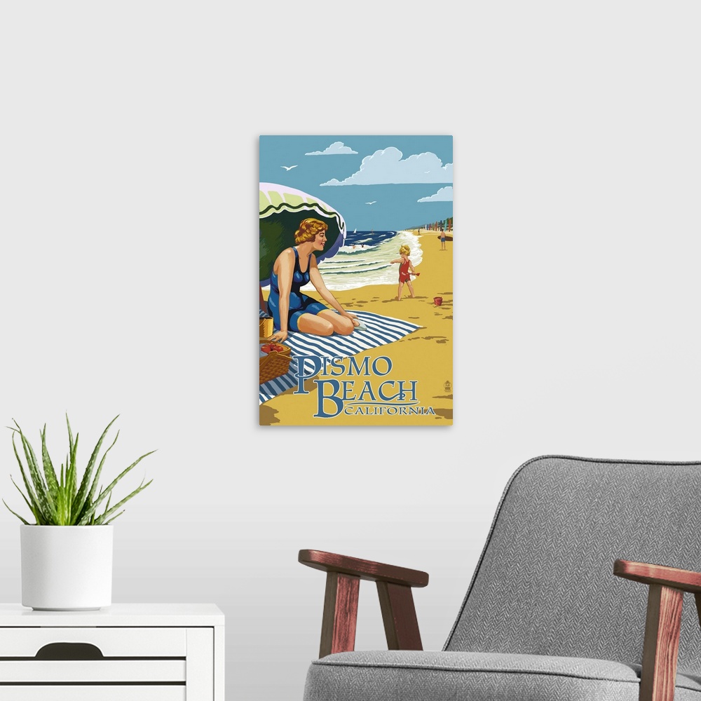 A modern room featuring Retro stylized art poster of a beach scene, with a woman sitting on a blanket under a an umbrella.