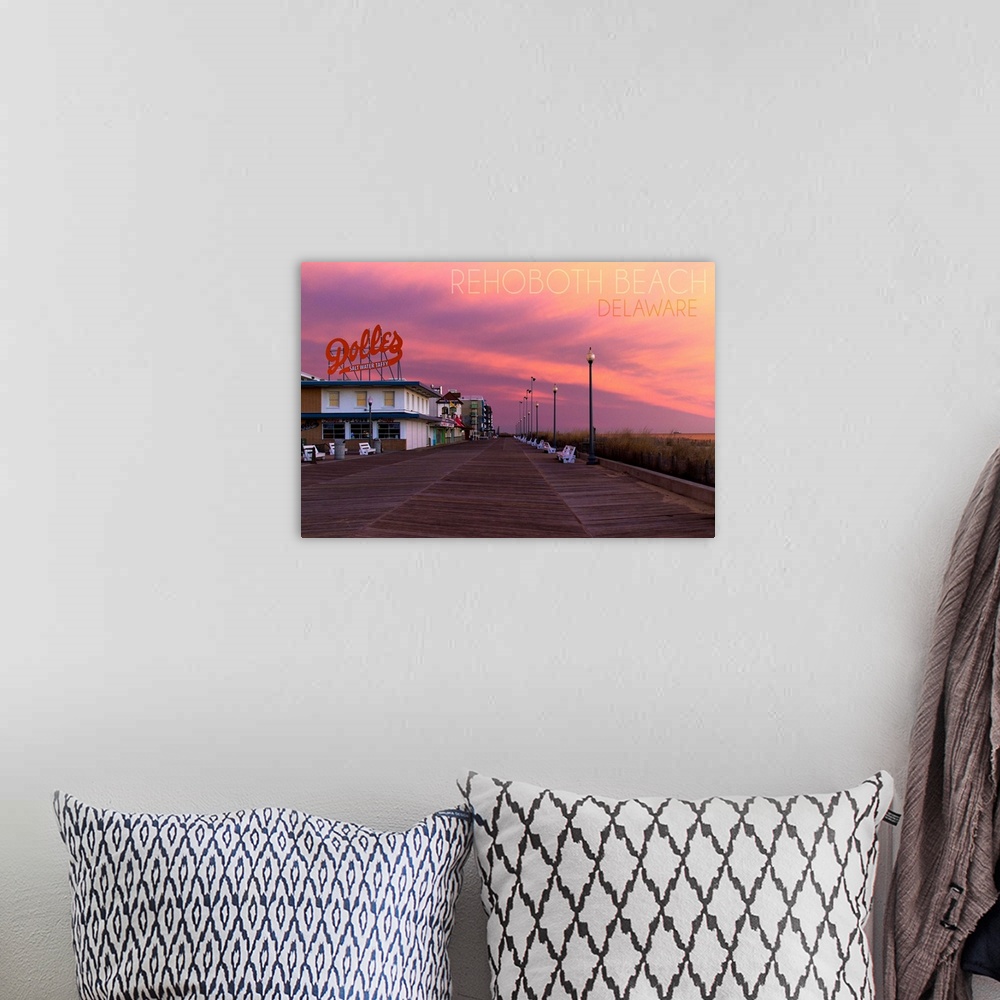 A bohemian room featuring Photograph of Rehoboth Beach, Delaware of the Dolles candy store and vibrant sunset.