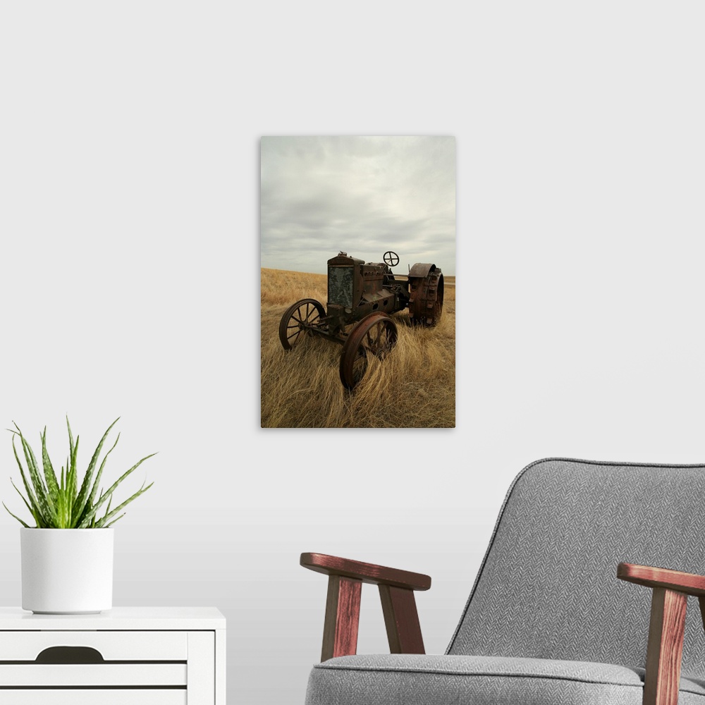 A modern room featuring Rusty Tractor In Field