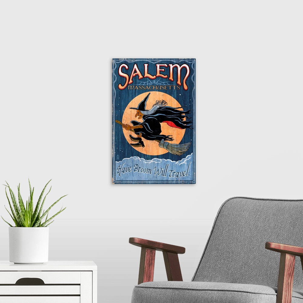 A modern room featuring Retro stylized art poster of a vintage sign with a profile of a witch flying in front of a moon.