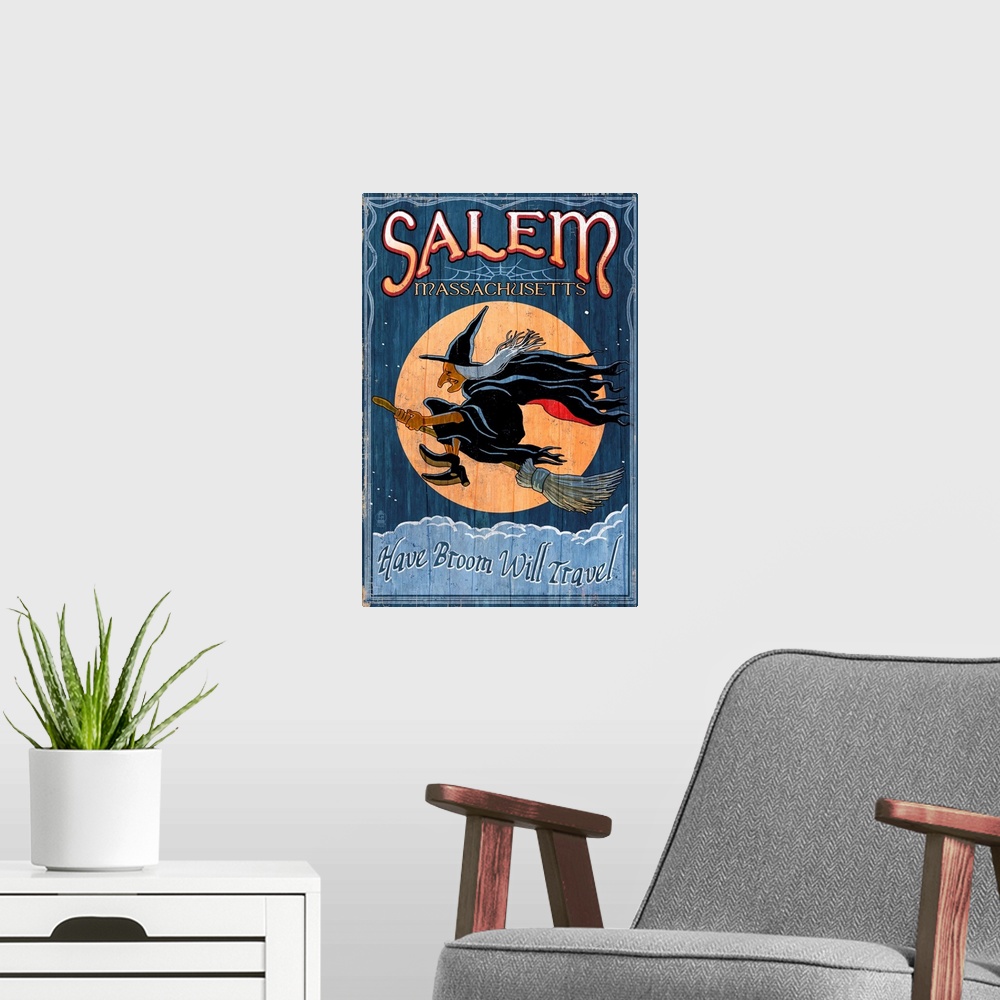 A modern room featuring Retro stylized art poster of a vintage sign with a profile of a witch flying in front of a moon.