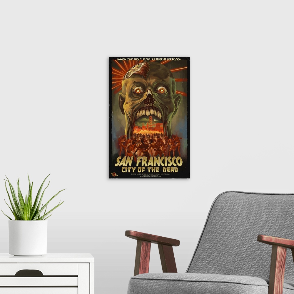 A modern room featuring Retro stylized art poster of a zombie head opening its mouth, to reveal a city being being mobbed...