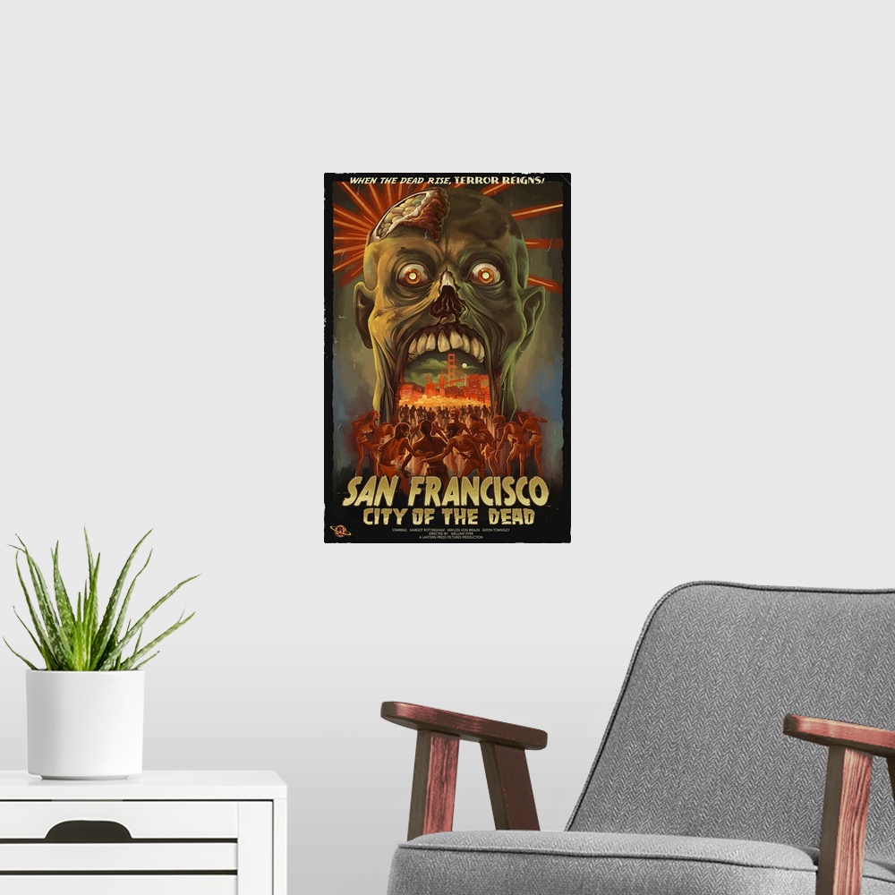 A modern room featuring Retro stylized art poster of a zombie head opening its mouth, to reveal a city being being mobbed...