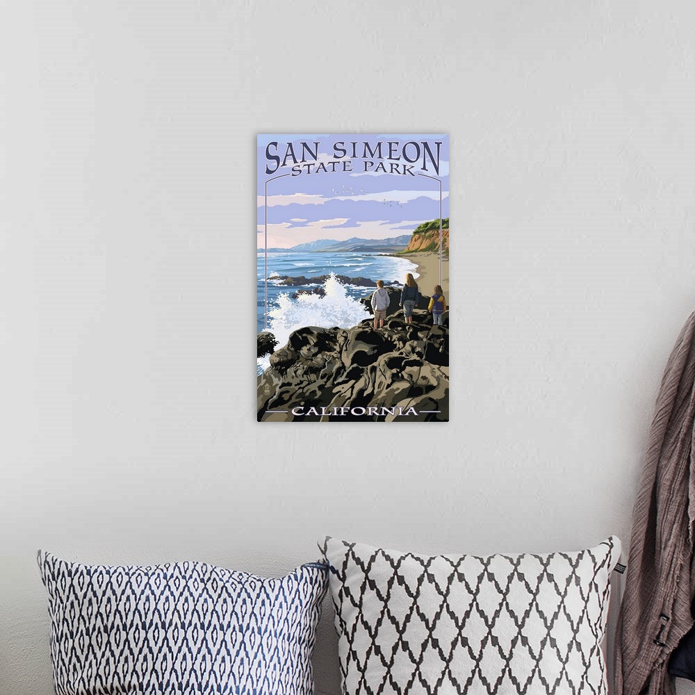 A bohemian room featuring Retro stylized art poster of a group of people standing on rocks looking out over the ocean.
