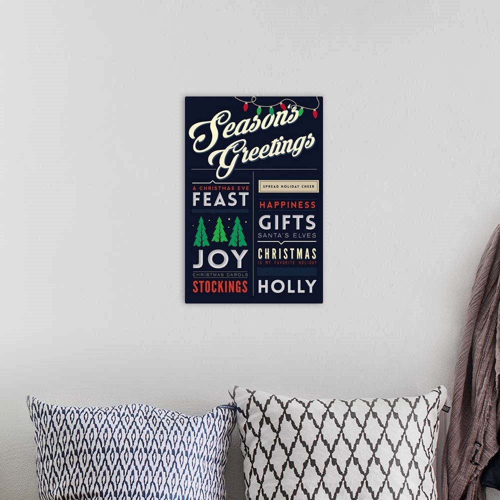 A bohemian room featuring Christmas typography artwork.