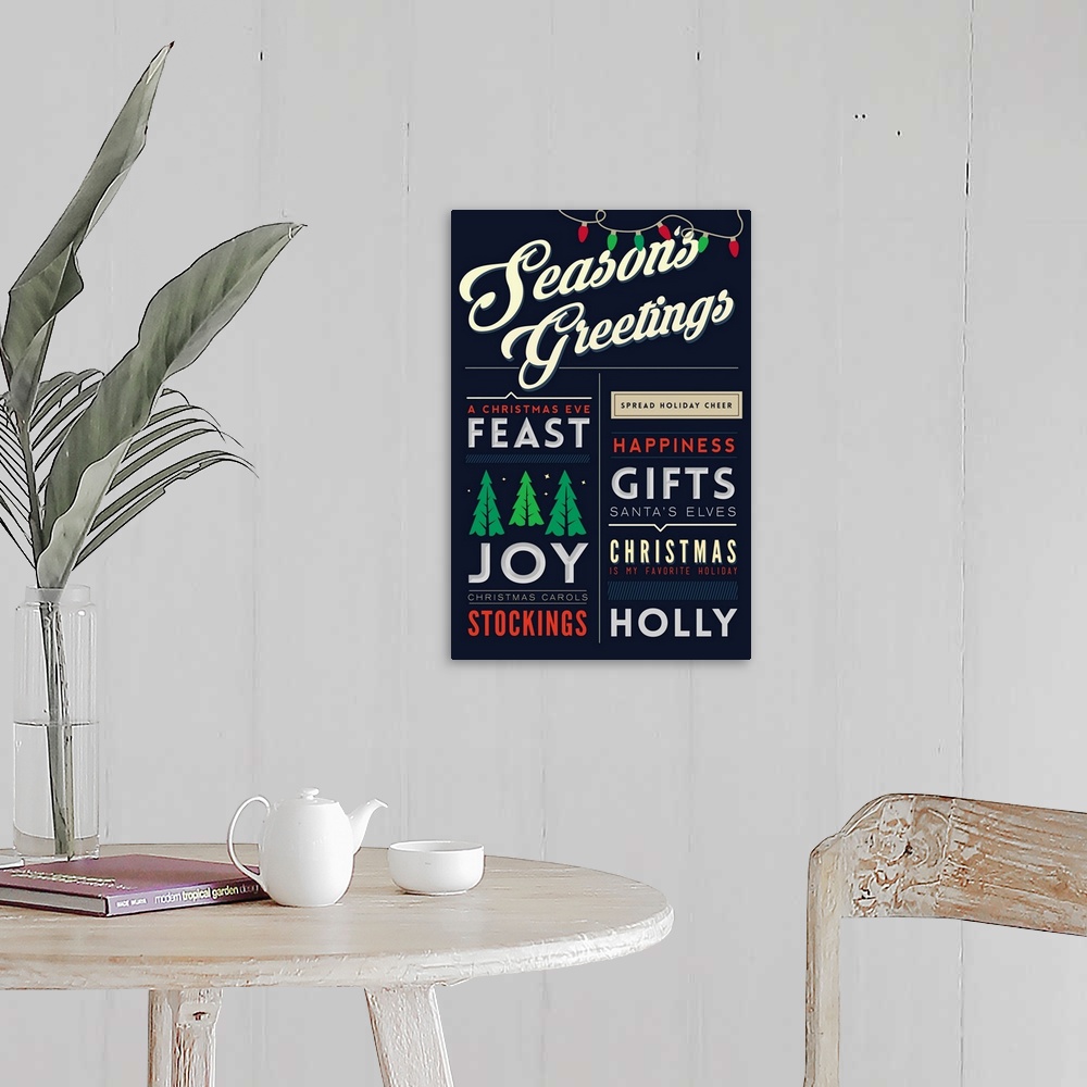 A farmhouse room featuring Christmas typography artwork.