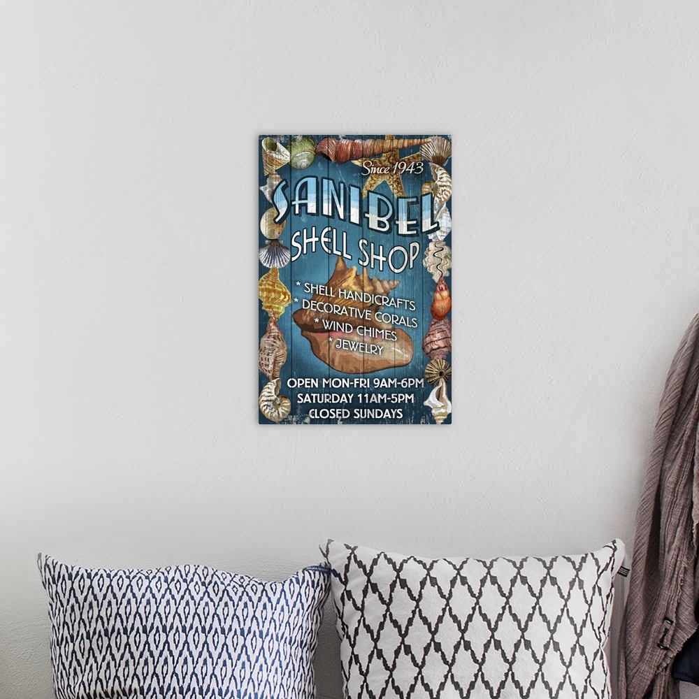 A bohemian room featuring Retro stylized art poster of a vintage sign with shell on it.