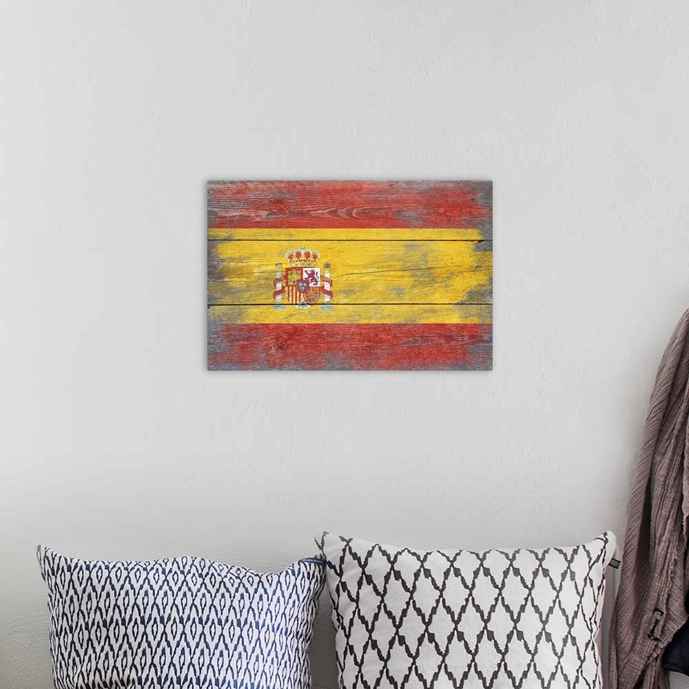 A bohemian room featuring The flag of Spain with a weathered wooden board effect.