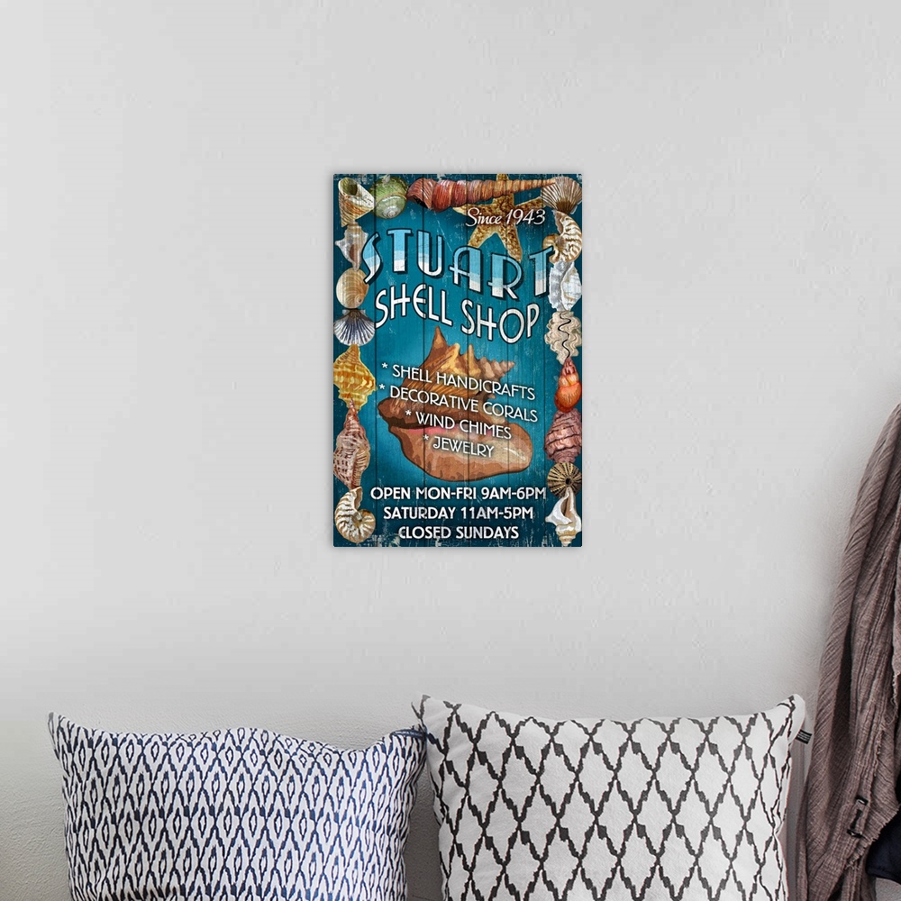 A bohemian room featuring Retro stylized art poster of a vintage sign with seashell on it.