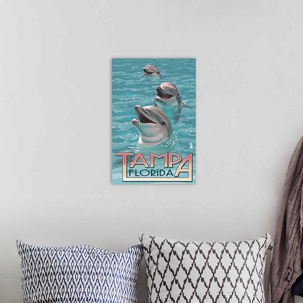 A bohemian room featuring Retro stylized art poster of three dolphins with their heads sticking out of the water.