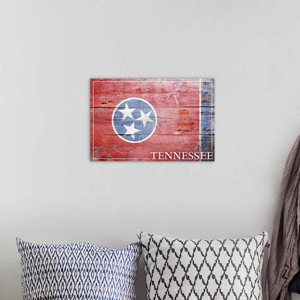 A bohemian room featuring The flag of Tennessee with a weathered wooden board effect.