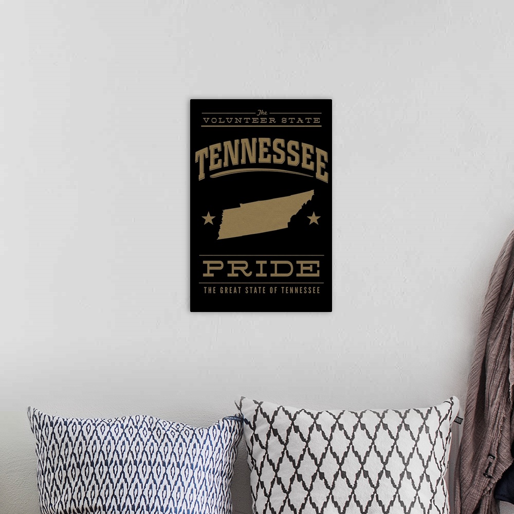 A bohemian room featuring The Tennessee state outline on black with gold text.