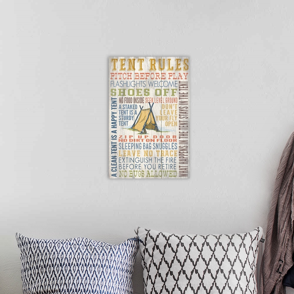 A bohemian room featuring Tent Rules Typography