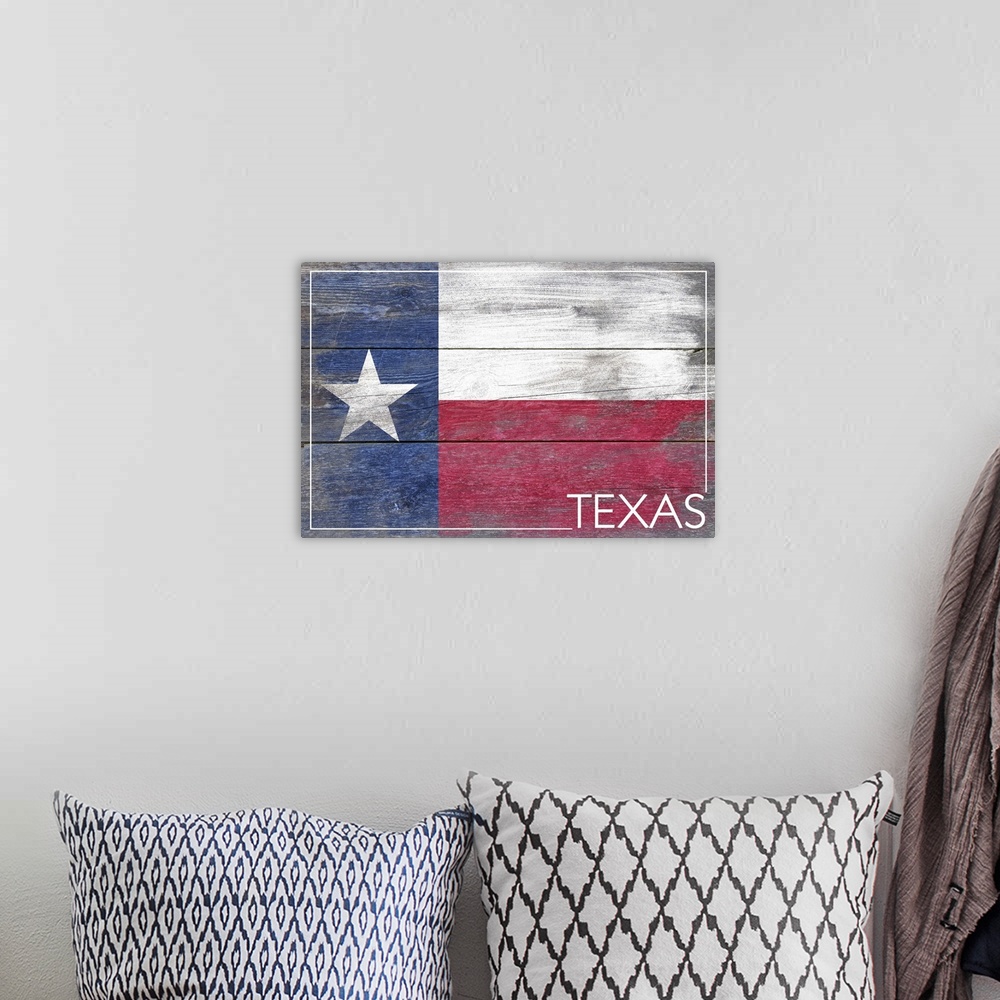 A bohemian room featuring The flag of Texas with a weathered wooden board effect.