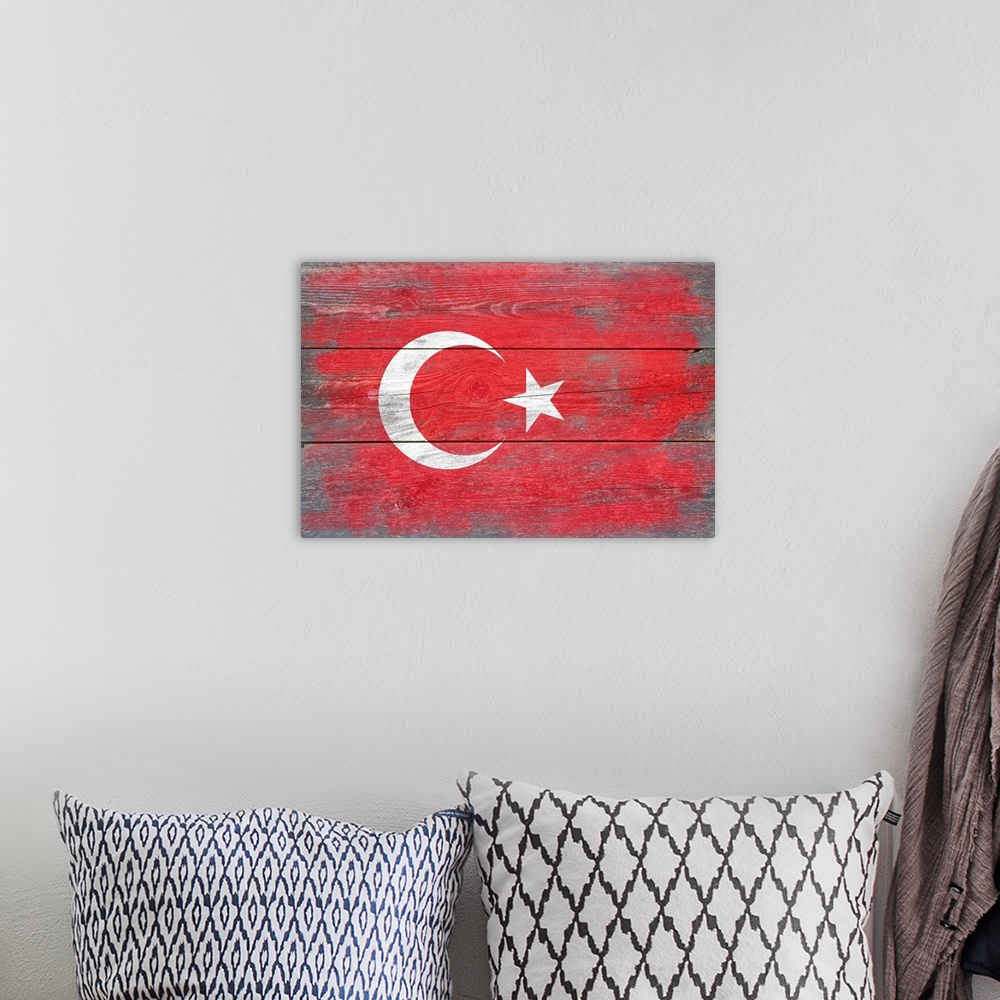 A bohemian room featuring The flag of Turkey with a weathered wooden board effect.