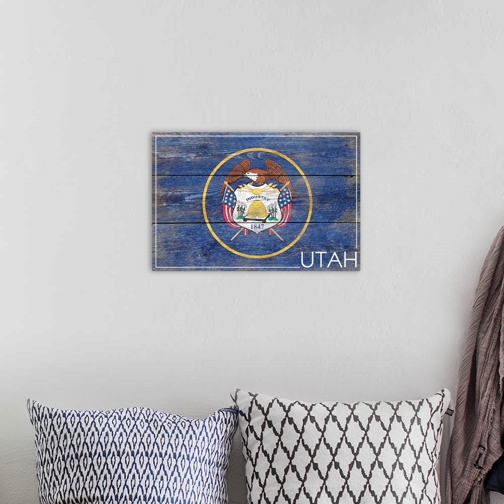 A bohemian room featuring The flag of Utah with a weathered wooden board effect.